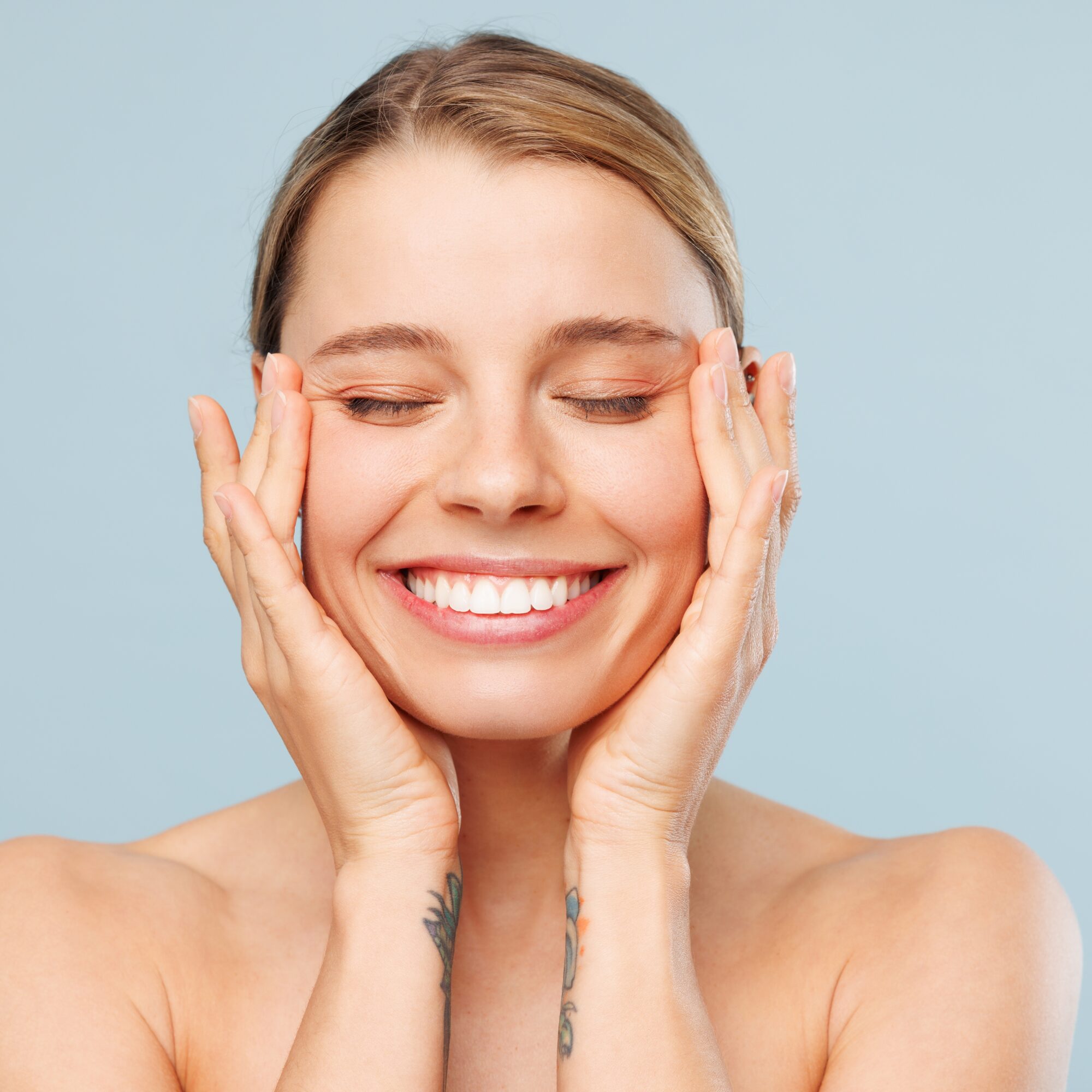 beautiful woman isolated on plain pastel blue color wall background, skin care treatment, Morpheus 8