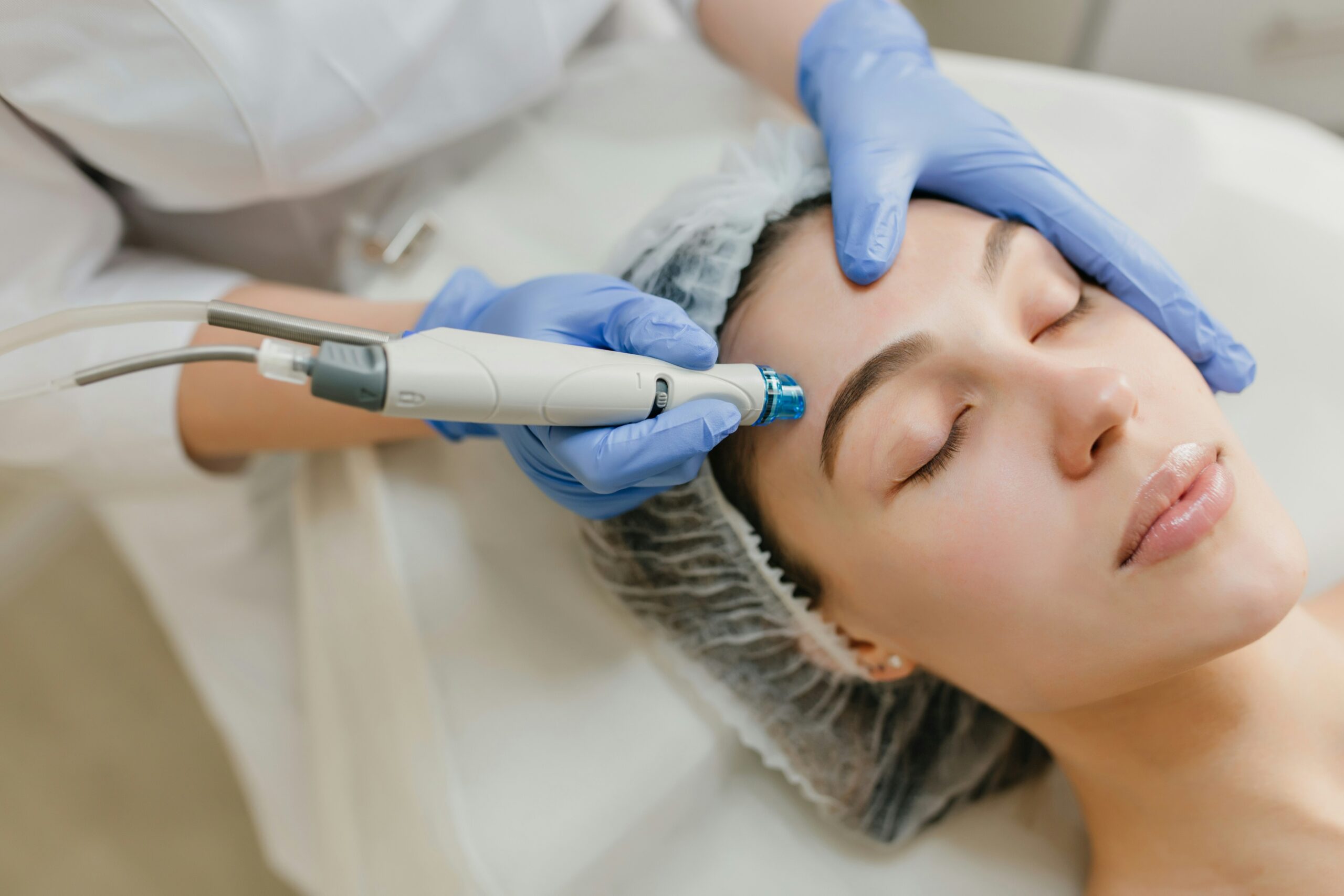 CImage of a young woman receiving a Hydra Facial treatment